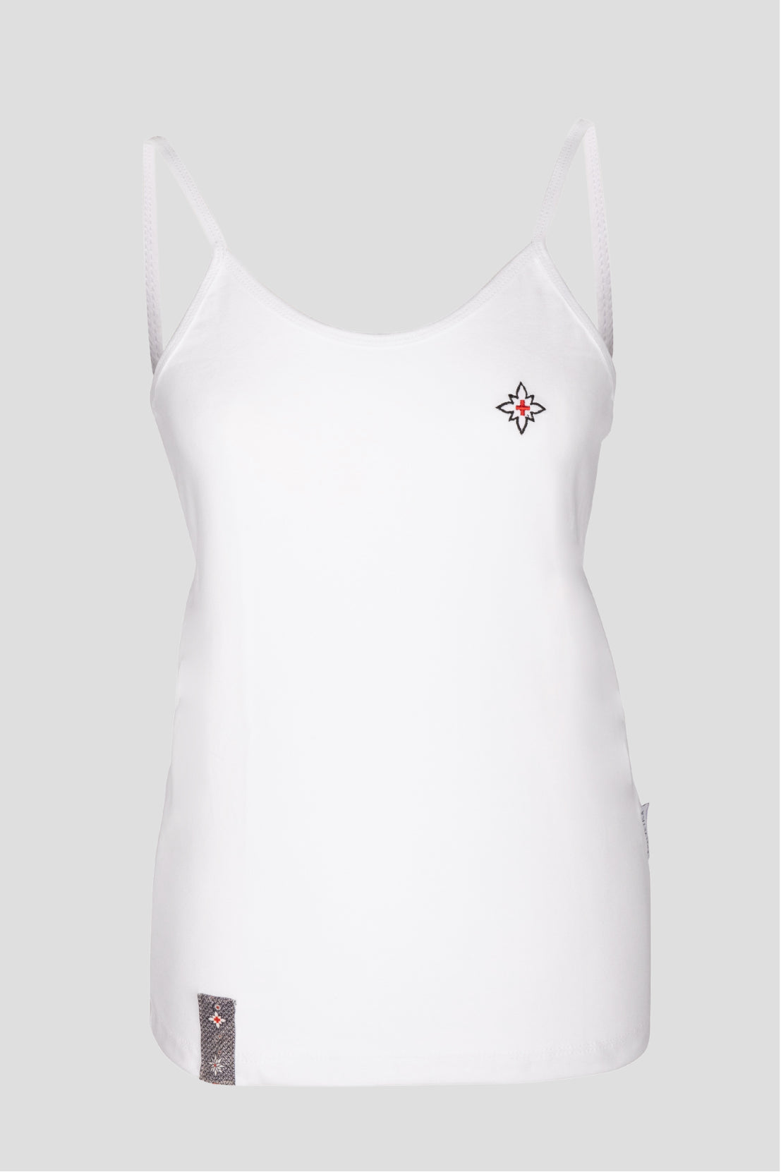 Damen Edelweiss Spaghetti-Top von Edelvetica, ein elegantes und sommerliches Kleidungsstück. Dieses Top zeichnet sich durch ein feines Edelweiss-Muster aus und bietet einen leichten und luftigen Tragekomfort. Ideal für warme Tage, kombiniert es schweizerische Tradition mit einem femininen und modernen Stil
