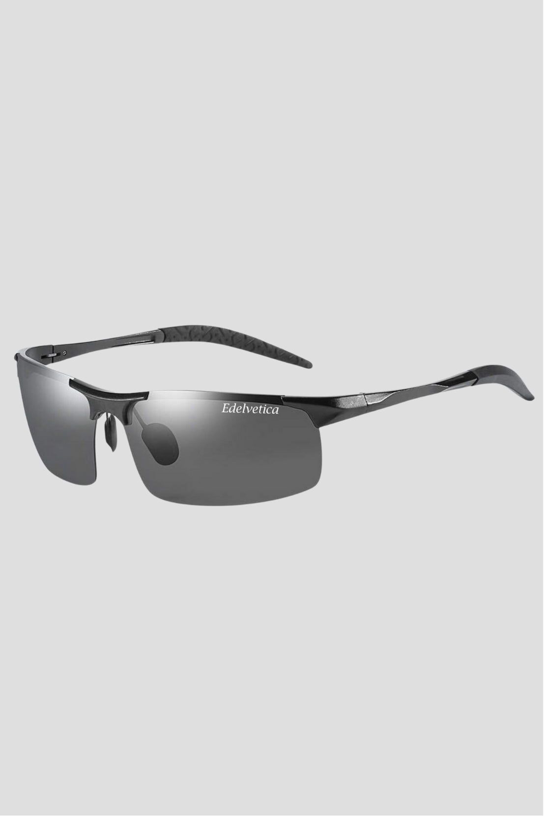 Unisex Sonnenbrille 'Race' von Edelvetica, ein sportliches und dynamisches Design. Diese Sonnenbrille präsentiert einen modernen, aerodynamischen Stil, perfekt für Aktivitäten und Lebensstile mit hohem Tempo. Sie bietet sowohl für Männer als auch für Frauen einen trendigen und funktionalen Sonnenschutz.